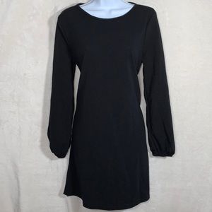 Woman’s long sleeve black dress. Size Medium